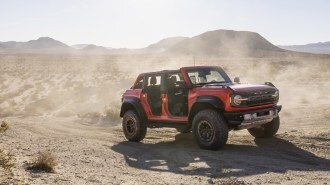 2022 Ford Bronco Raptor Driving Desert Front Three Quarter