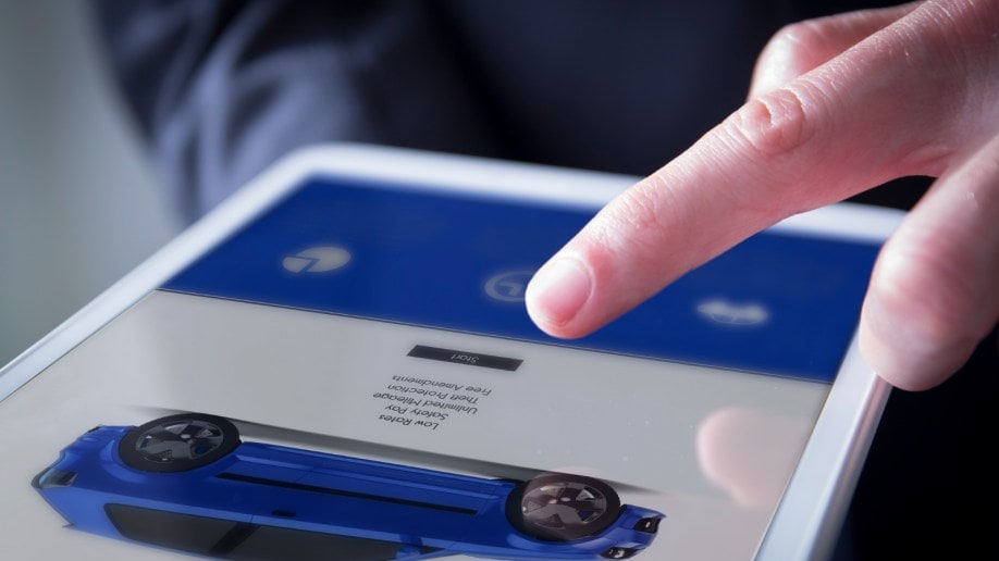 Finger Touches Digital Tablet With Car Website Picture for Selling or Buying Online