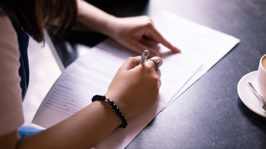 Woman signing document