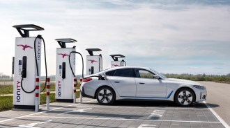 The 2023 BMW i4 plugged in to charge