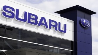 A Subaru sign on a dealership