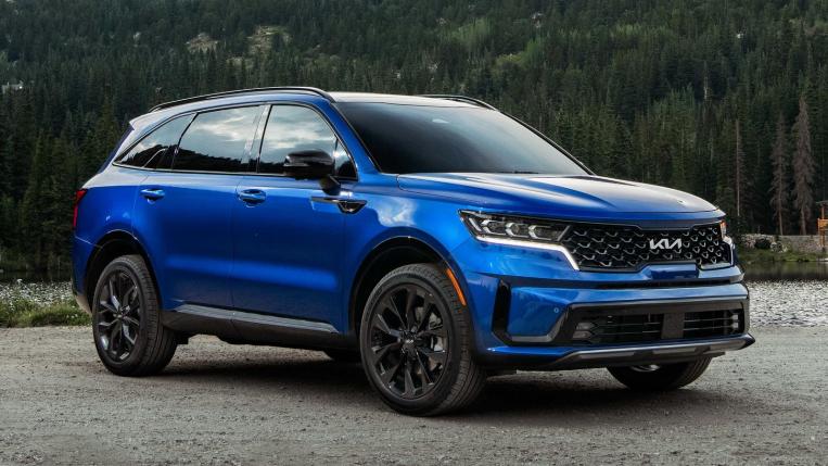 2022 Sorento SX near trees in blue