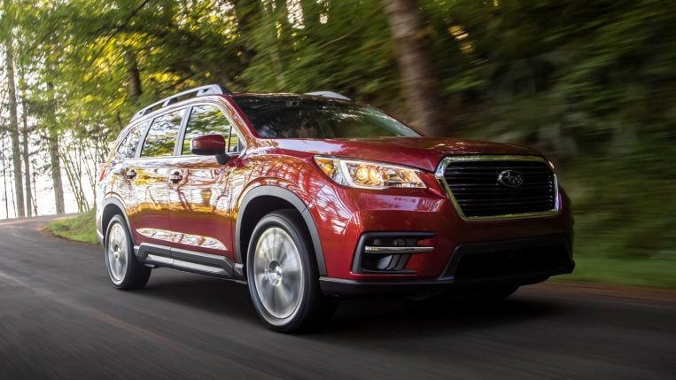 2022 Subaru Ascent Limited near trees in red