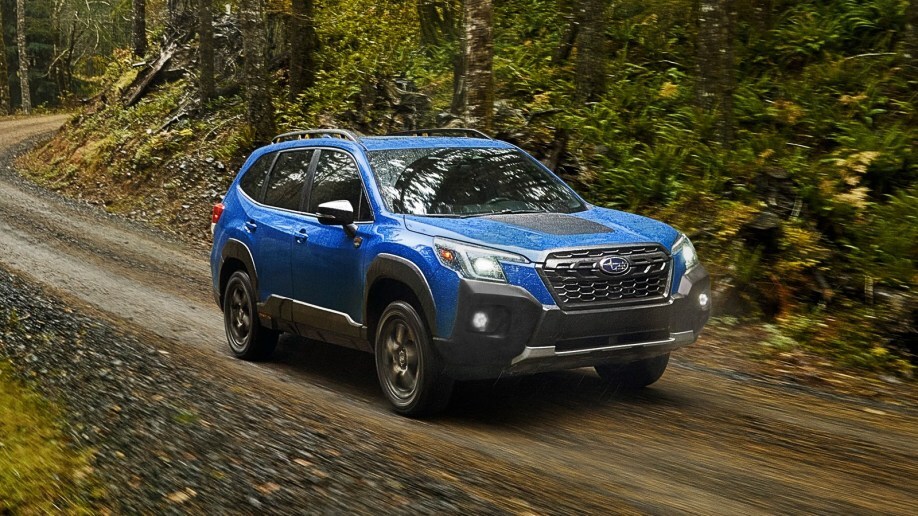 2022 Subaru Forester Wilderness driving in forest.