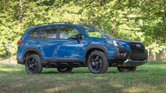 2022 Subaru Forester near trees in blue