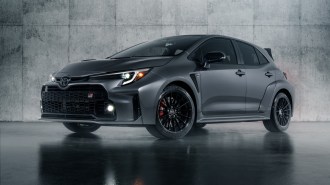 The 2023 Toyota GR Corolla in grey, seen from a front quarter angle.