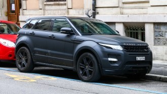A Range Rover Evoque with a dark matte finish..