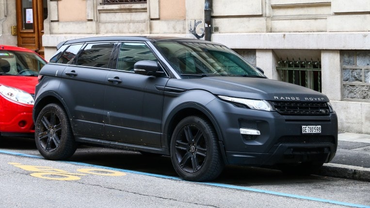 A Range Rover Evoque with a dark matte finish..