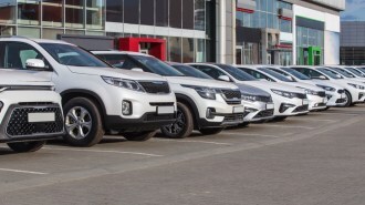 A line of cars at a dealership
