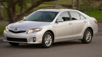 2011 Toyota Camry Hybrid in silver.
