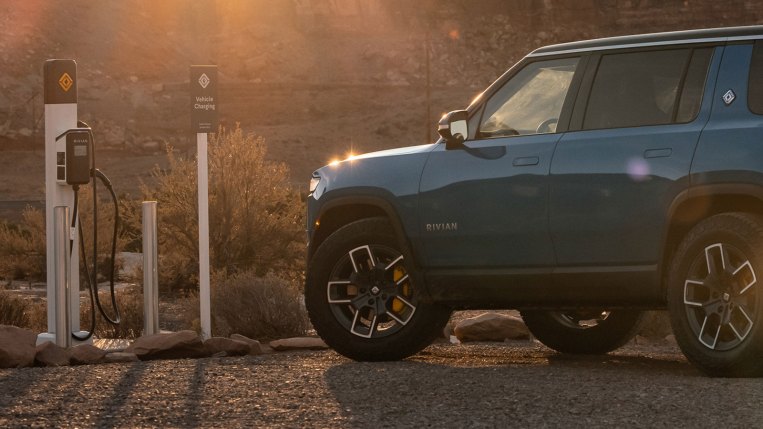 Charging a Rivian R1S at a desert charging station