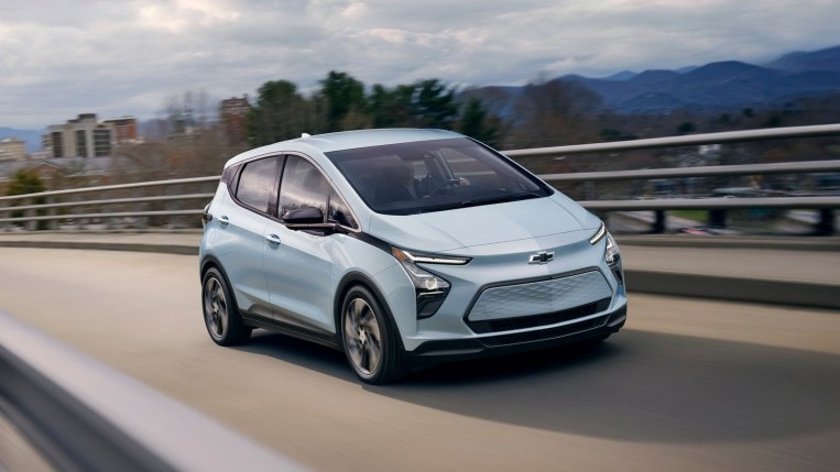 2023 Chevrolet Bolt EV front three-quarter driving on an overpass