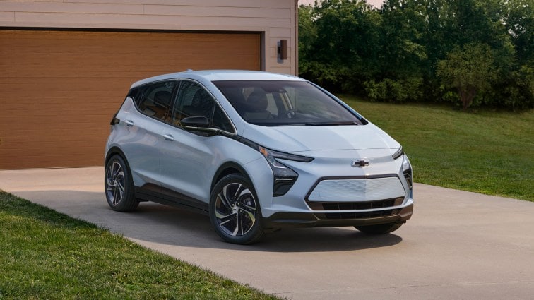 2023 Chevrolet Bolt EV front three-quarter backed-in on a residential driveway