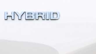 A hybrid badge on a vehicle