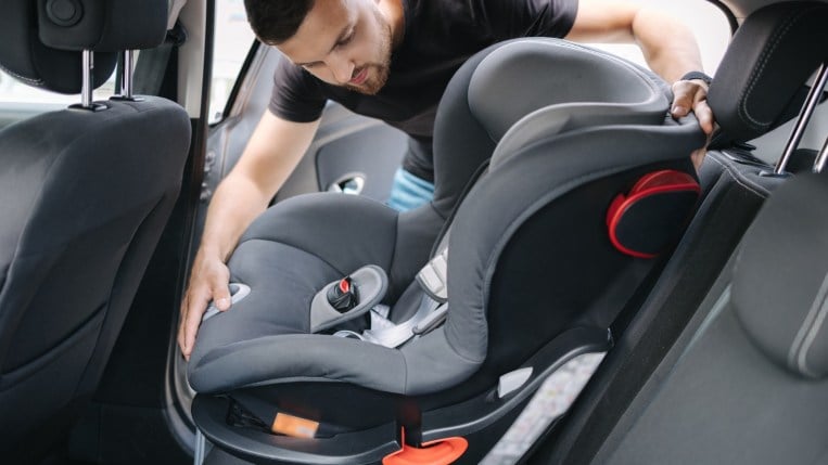 Man Installs A Child Car Seat on LATCH system