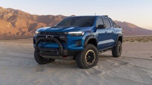 The 2023 Chevy Colorado ZR2 in blue. We see the truck from a front quarter angle, facing to our left.
