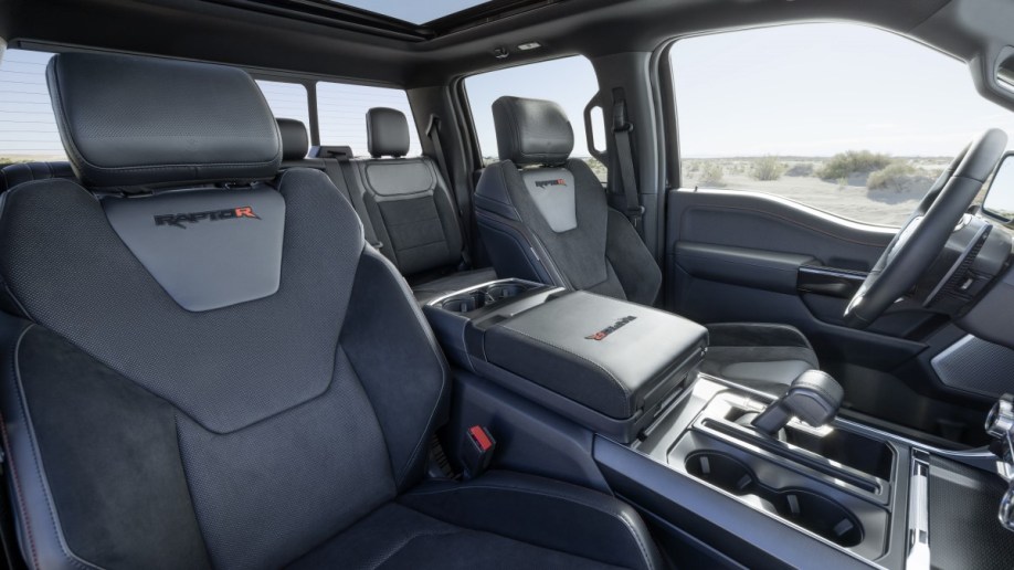 The interior of the 2023 Ford F-150 Raptor R. It is upholstered in black leather and Alcantara faux suede.