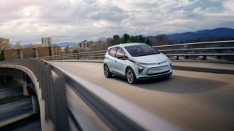 A Chevy Bolt EV driving on a highway