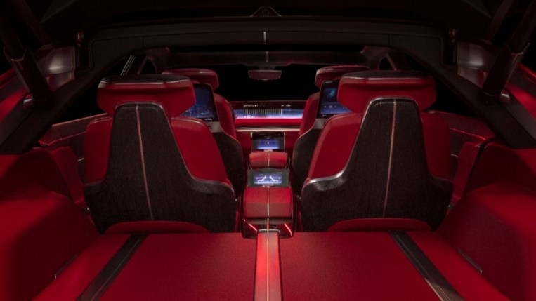 A teaser photo shows the cargo area of the Cadillac Celestiq show car. We see the back of the rear seats. They are upholstered in blood red leather, with black and brushed nickel accents.