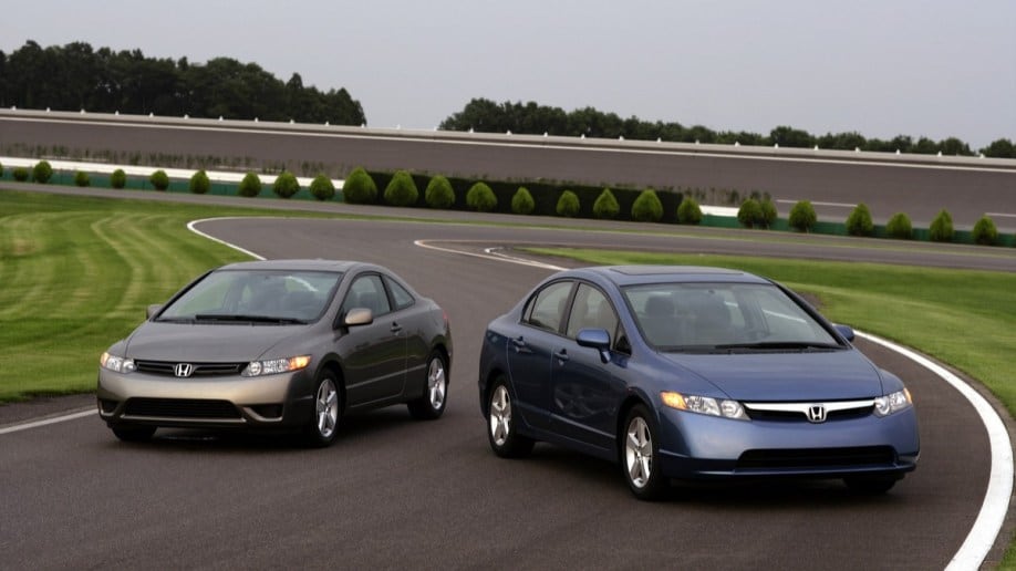 A pair of ninth-generation Honda Civics.