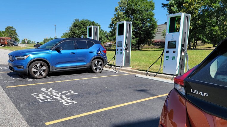 A Volvo Recharge and Nissan Leaf at a charging station