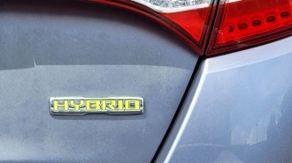 Hybrid badge on a car trunk
