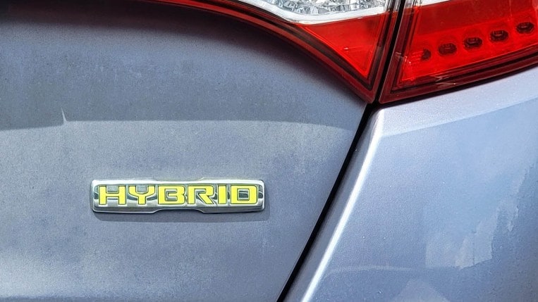 Hybrid badge on a car trunk