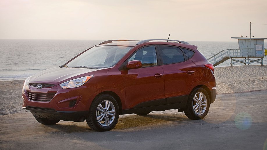 2011 Hyundai Tucson in red.