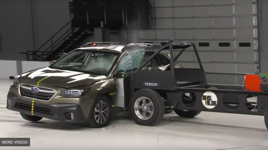 A screenshot of the Insurance Institute for Highway Safety's side-impact crash test of the 2022 Subaru Outback, showing the sled hitting below the car's side windows