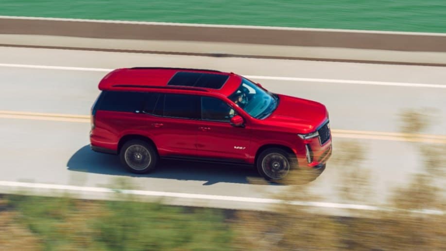 The 2023 Cadillac Escalade-V high-performance SUV in red, seen from overhead.