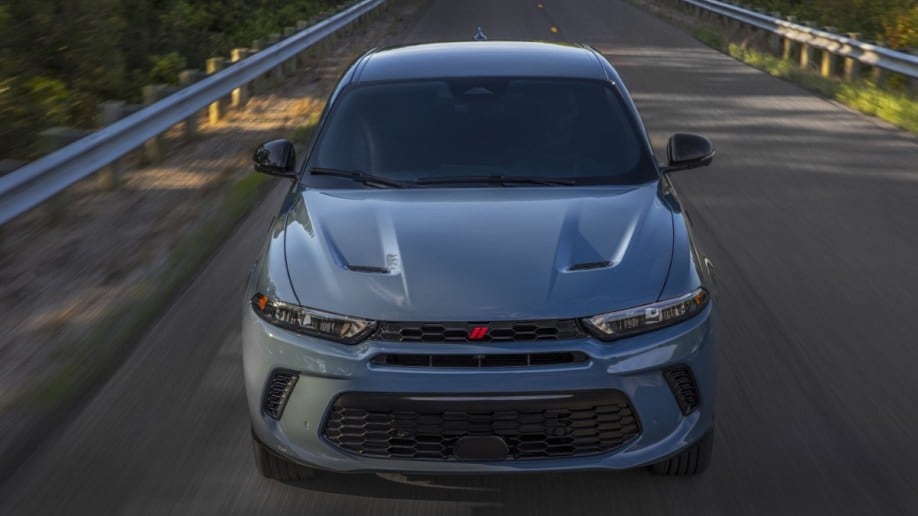 The 2023 Dodge Hornet seen from head-on. The SUV is a chalky shade of blue, with vents and deep character lines in its hood.