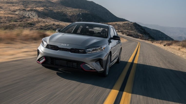 The 2023 Kia Forte seen from a head-on angle, driving toward the camera.