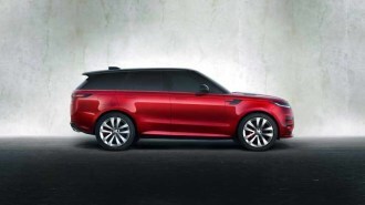 The 2023 Range Rover Sport in red, seen in profile