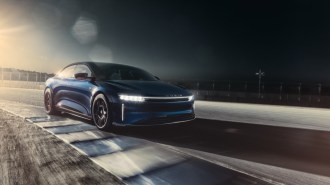 The Lucid Air Sapphire laps the race course at Laguna Seca. We see it from a front quarter angle.