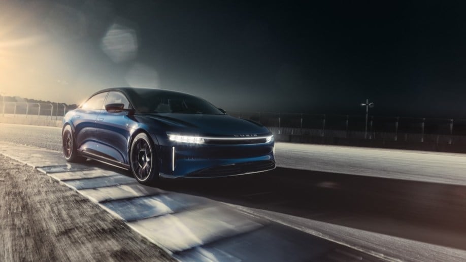 The Lucid Air Sapphire laps the race course at Laguna Seca. We see it from a front quarter angle.