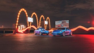 The Porsche 911 Sally special edition parked alongside a non-driving replica of the movie car