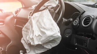 An airbag lays deflated after an accident