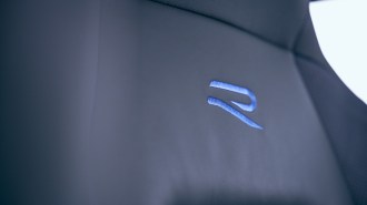 The seats of the 2023 VW Golf R with the R logo in blue