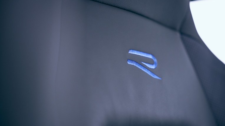 The seats of the 2023 VW Golf R with the R logo in blue