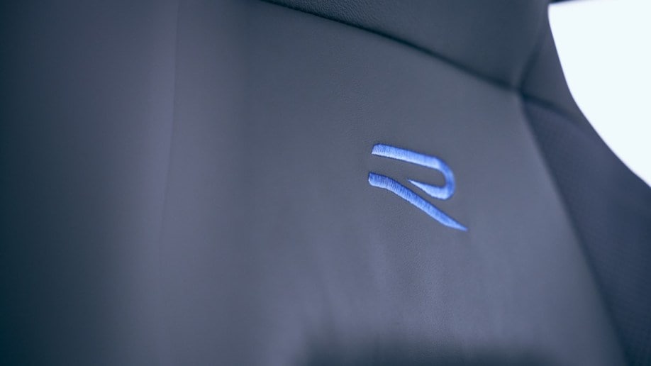 The seats of the 2023 VW Golf R with the R logo in blue