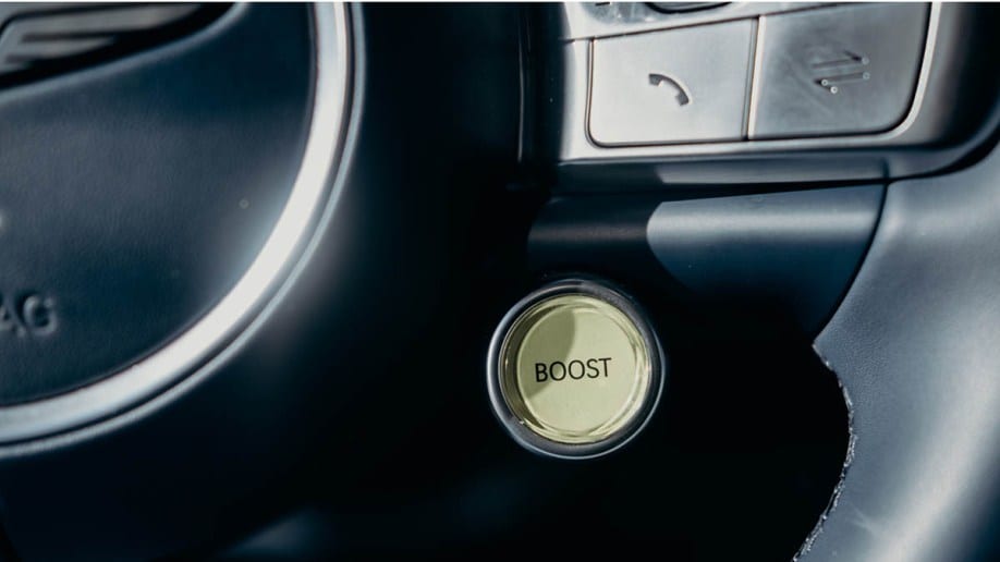 Genesis GV60 Boost Button on the steering wheel.