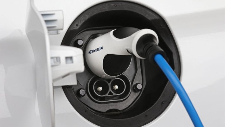 a hyundai ioniq connected to a charging cable