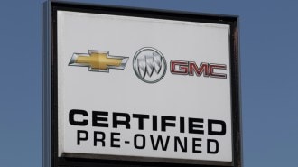 A sign on a certified pre-owned car lot.
