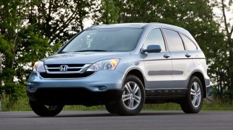 Silver 2011 Honda CR-V EX-L near trees