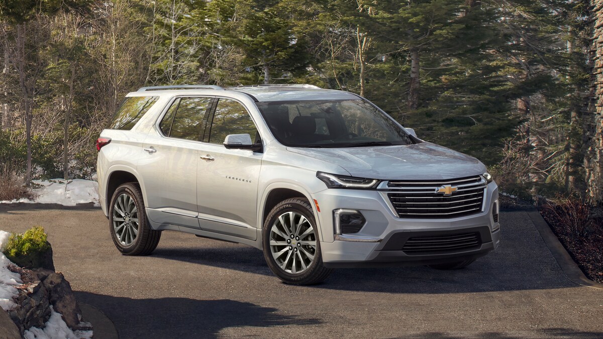 Silver 2023 Chevrolet Traverse Premier in snowy forest