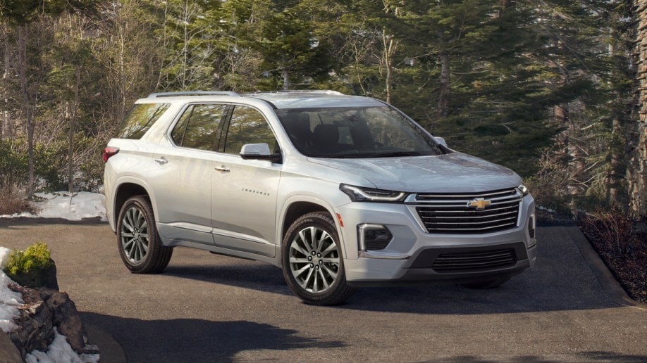 Silver 2023 Chevrolet Traverse Premier in snowy forest