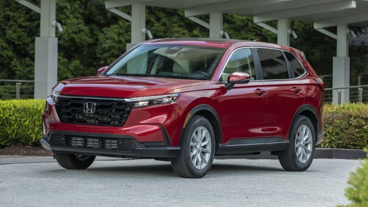 A red 2023 Honda CR-V stationary and pictured from the front.