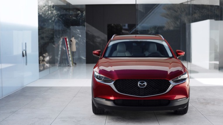 The 2023 Mazda CX-30 in red, seen from head-on