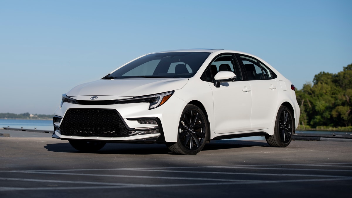 2023 Toyota Corolla in white near a lake.