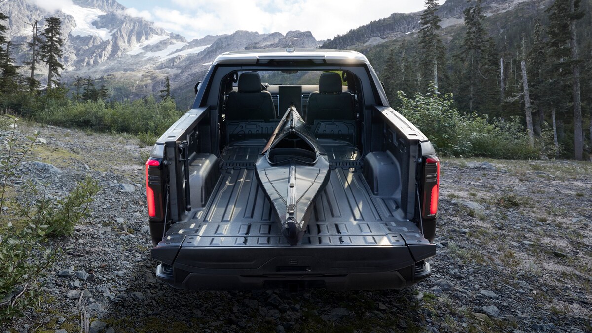 2024 GMC Sierra EV Denali Edition canoe in bed.